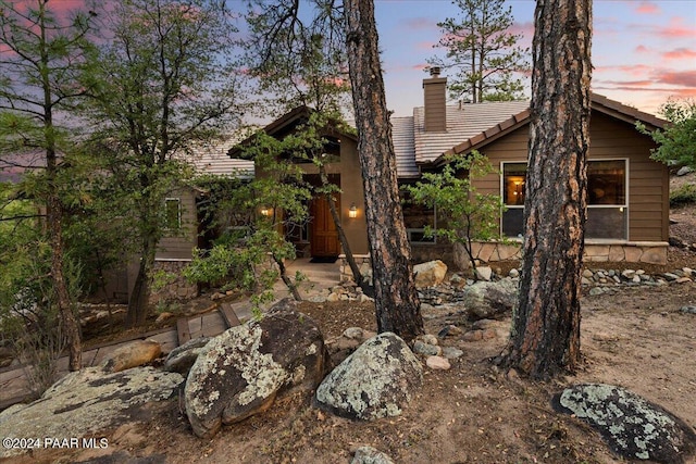 view of property exterior at dusk