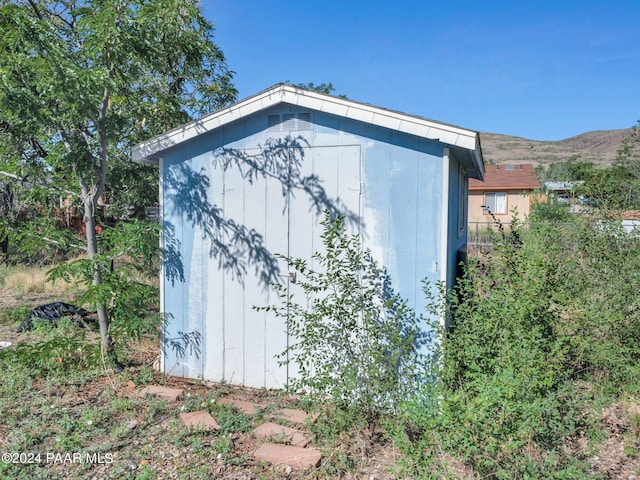 view of outbuilding with a mountain view