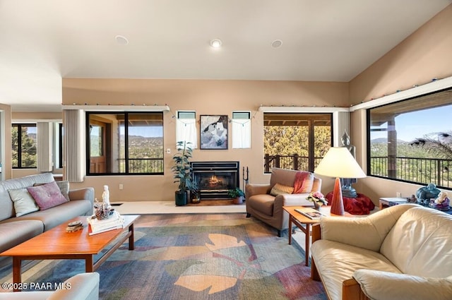 435 Fairway View Dr, Prescott, AZ 86303 - living area with plenty of natural light, a glass covered fireplace, and wood finished floors