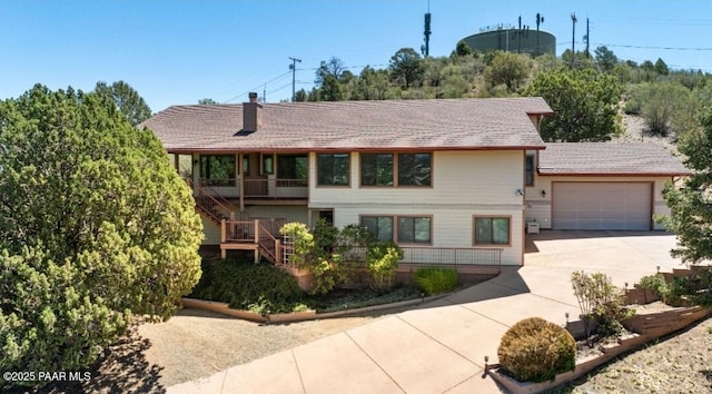435 Fairway View Dr, Prescott, AZ 86303 - view of front facade with driveway, a garage, stairs, and a chimney