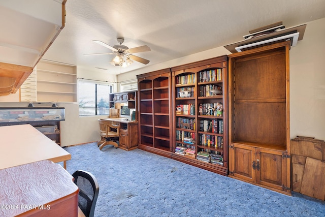 home office with carpet floors and ceiling fan