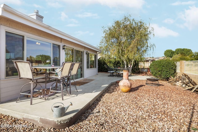 view of patio featuring a fire pit