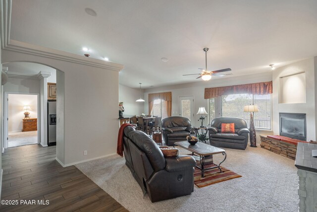 10559 Manzanita Trl, Dewey-Humboldt, AZ 86327 - living room with ceiling fan, a fireplace, and light carpet