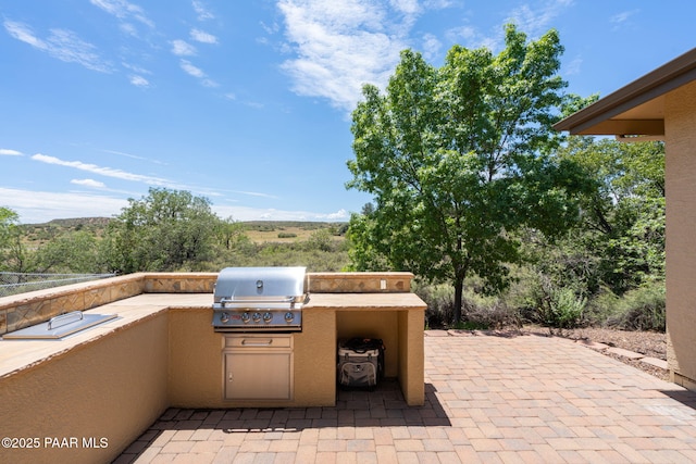 10559 Manzanita Trl, Dewey-Humboldt, AZ 86327 - view of patio with exterior kitchen and a grill