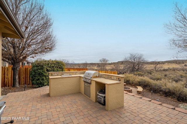 10559 Manzanita Trl, Dewey-Humboldt, AZ 86327 - back of house featuring a patio area and a fire pit