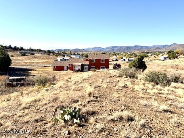 view of yard featuring a mountain view and a rural view