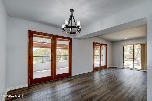 285 E Crestwood, Prescott, AZ 86303 - spare room with baseboards, a notable chandelier, french doors, and dark wood-type flooring
