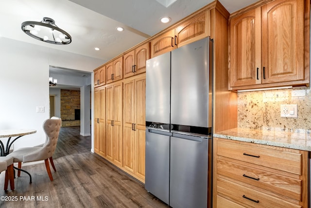 285 E Crestwood, Prescott, AZ 86303 - kitchen featuring recessed lighting, dark wood-type flooring, backsplash, light stone counters, and freestanding refrigerator