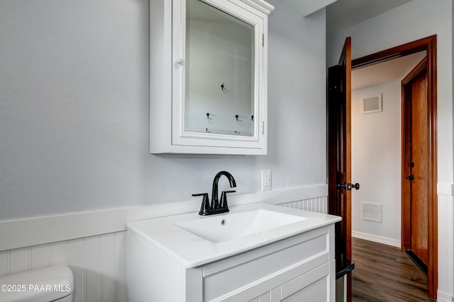 285 E Crestwood, Prescott, AZ 86303 - half bathroom with toilet, vanity, wood finished floors, and visible vents