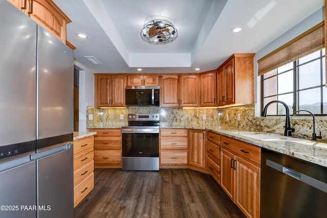 285 E Crestwood, Prescott, AZ 86303 - kitchen with light stone countertops, stainless steel appliances, tasteful backsplash, dark wood finished floors, and a sink