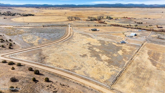 birds eye view of property featuring a mountain view