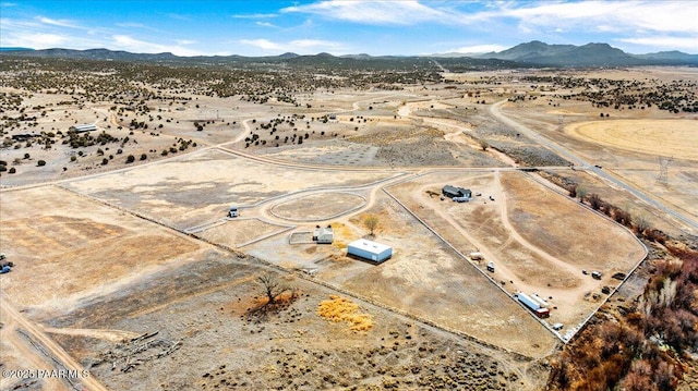 aerial view with view of desert and a mountain view