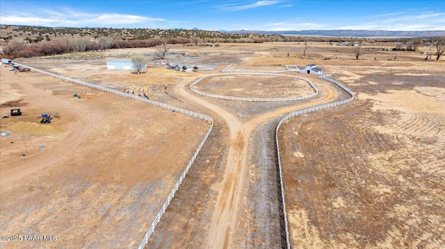birds eye view of property with a rural view