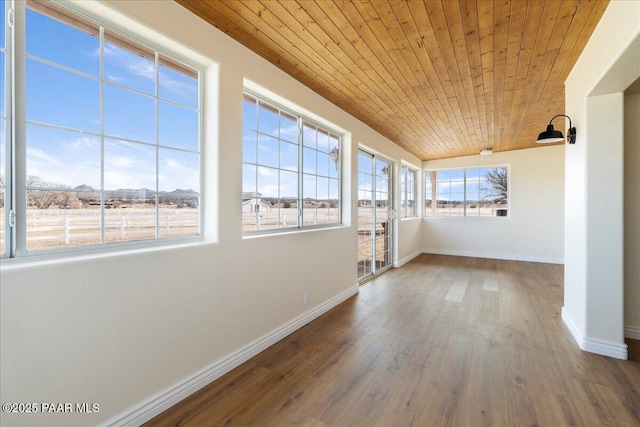 unfurnished sunroom featuring wood ceiling