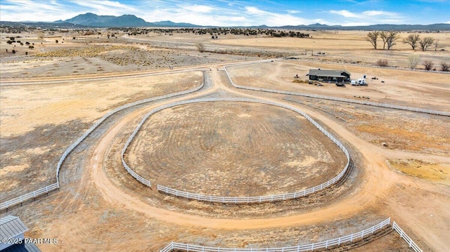 birds eye view of property with a rural view and a mountain view