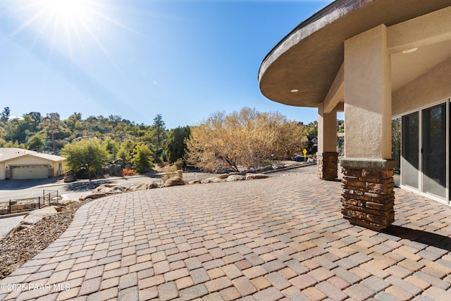 view of patio with a garage