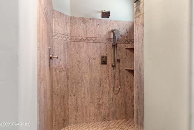 bathroom featuring a tile shower