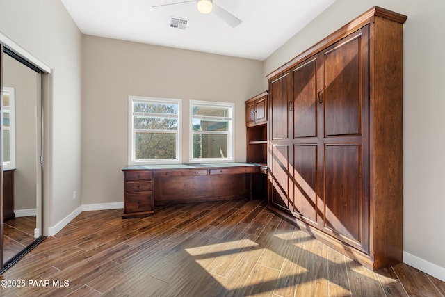 unfurnished office featuring ceiling fan