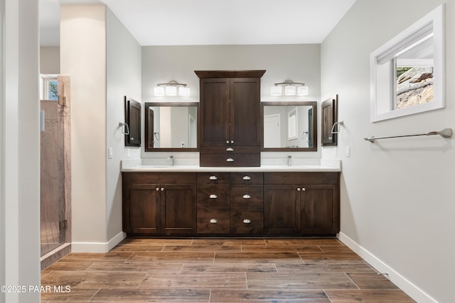 bathroom with vanity and a shower with shower door