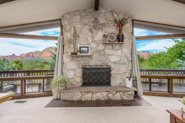 225 Sierra Rd, Sedona, AZ 86336 - detailed view of carpet flooring, beam ceiling, a stone fireplace, and a mountain view
