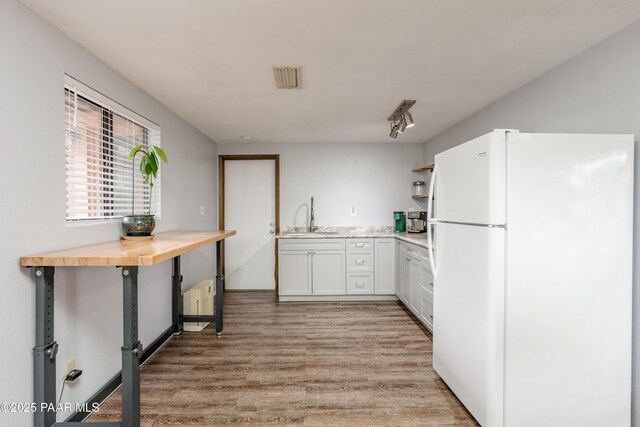 225 Sierra Rd, Sedona, AZ 86336 - kitchen with freestanding refrigerator, a sink, open shelves, light wood-style flooring, and white cabinetry