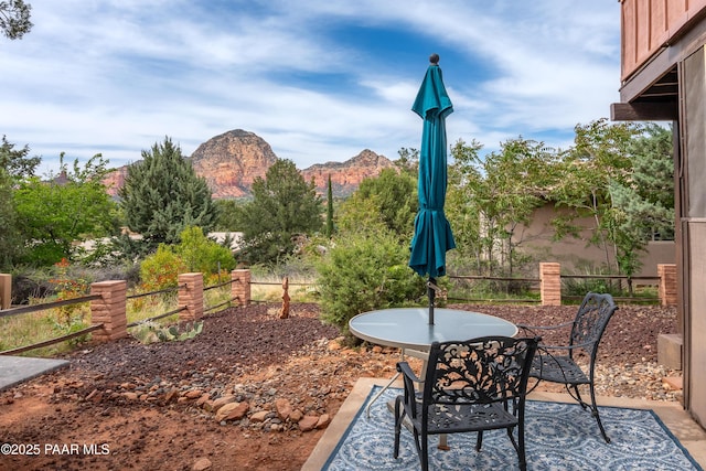 225 Sierra Rd, Sedona, AZ 86336 - view of patio featuring outdoor dining space, a mountain view, and fence