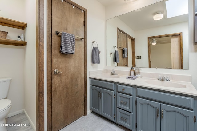 225 Sierra Rd, Sedona, AZ 86336 - bathroom with toilet, double vanity, and tile patterned floors