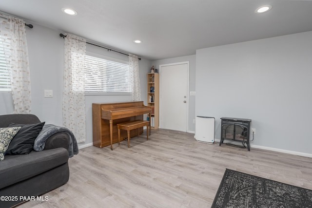 225 Sierra Rd, Sedona, AZ 86336 - living room featuring a wood stove, plenty of natural light, wood finished floors, recessed lighting, and baseboards