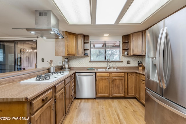 225 Sierra Rd, Sedona, AZ 86336 - kitchen featuring appliances with stainless steel finishes, open shelves, island range hood, and a sink
