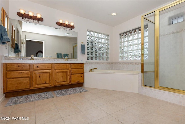 bathroom featuring tile patterned floors, vanity, and separate shower and tub