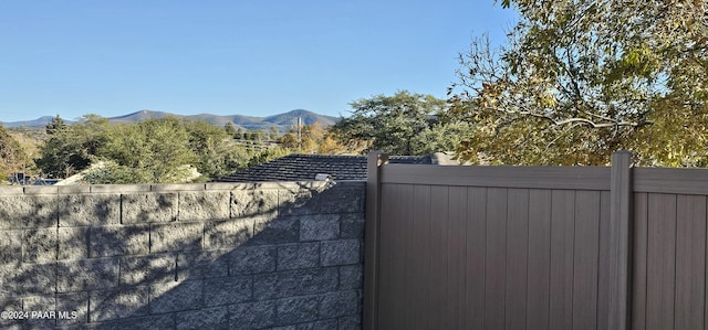 view of gate with a mountain view