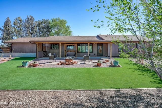 24585 N Catalina St, Paulden, AZ 86334 - rear view of house with a fire pit, a patio, and a yard