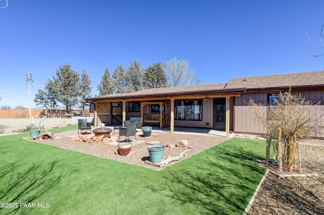 24585 N Catalina St, Paulden, AZ 86334 - back of house with a fire pit, a patio area, board and batten siding, and a yard