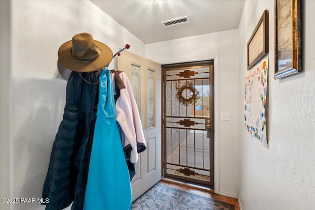 doorway to outside featuring visible vents