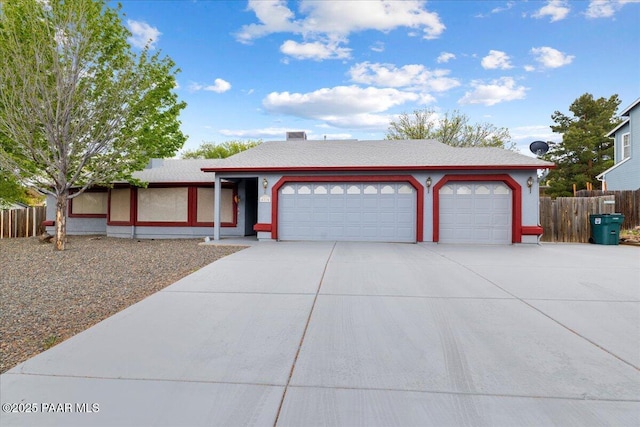 single story home with a garage, fence, and driveway