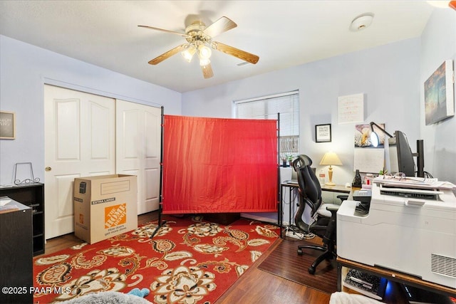 office space with a ceiling fan and wood finished floors