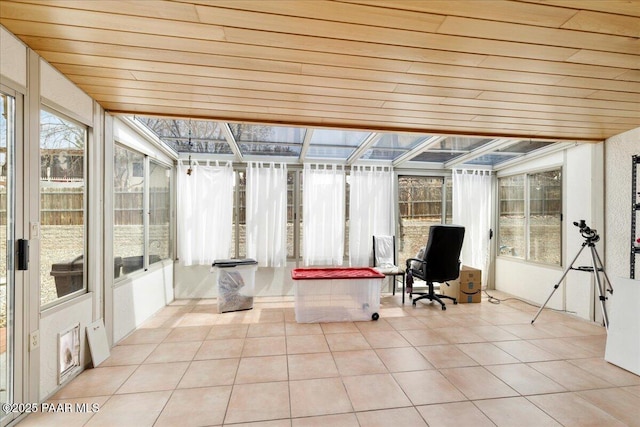 sunroom featuring wood ceiling and tile patterned flooring
