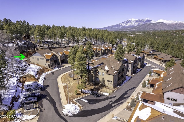 birds eye view of property featuring a mountain view and a residential view