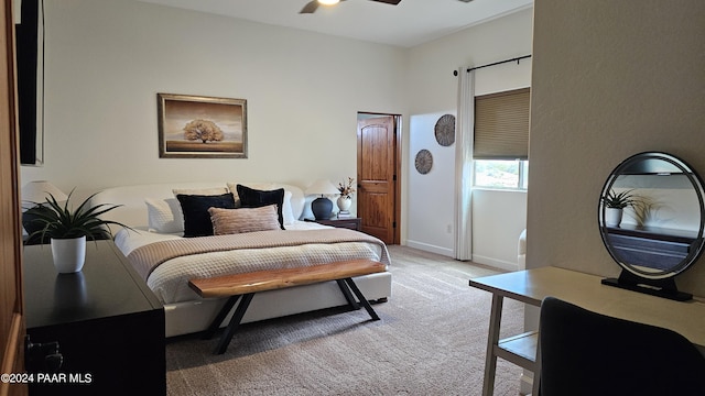 bedroom featuring ceiling fan and light colored carpet