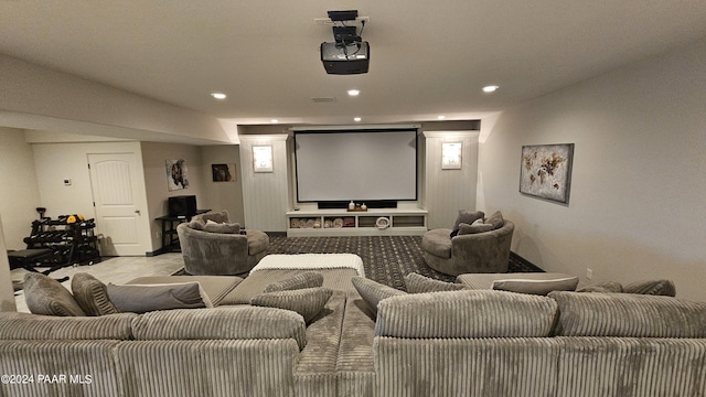 home theater room with light colored carpet