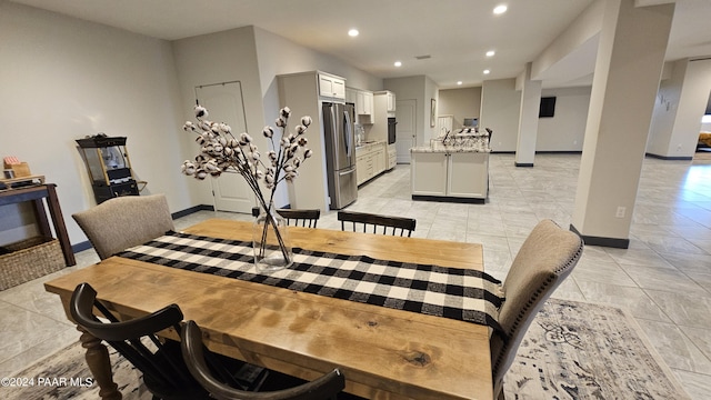 dining area with light tile patterned floors