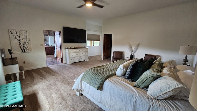 carpeted bedroom featuring connected bathroom and ceiling fan