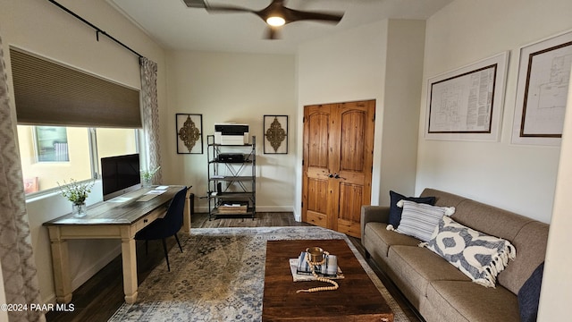 living room featuring ceiling fan and wood-type flooring