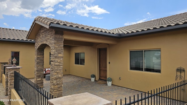 entrance to property with a patio area