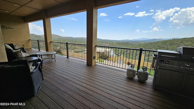 wooden deck with a mountain view