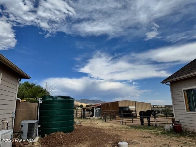 8183 N Blessing Ln, Prescott Valley, AZ 86315 - view of yard with an outbuilding, an exterior structure, and a mountain view