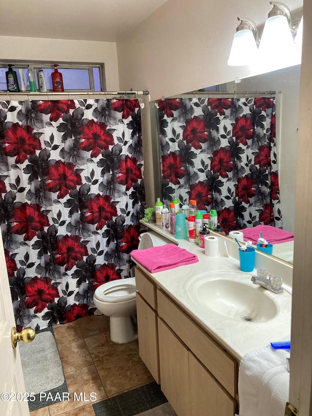 bathroom with vanity and toilet