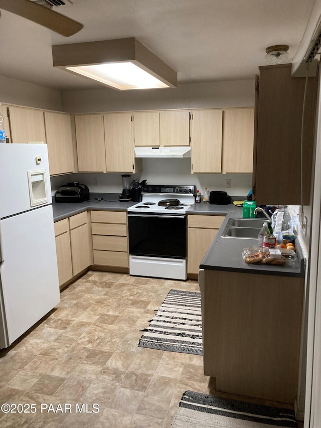 kitchen with light brown cabinetry, electric range, white fridge with ice dispenser, and sink