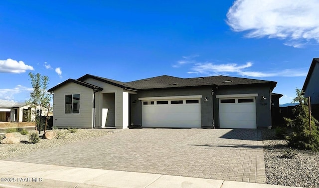 7639 E Louie Ln, Prescott Valley, AZ 86315 - view of front of house with a garage and decorative driveway