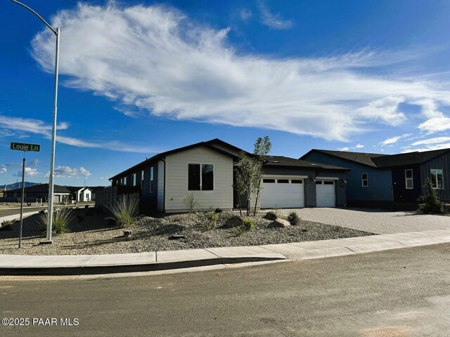 7639 E Louie Ln, Prescott Valley, AZ 86315 - view of front of home with an attached garage and driveway